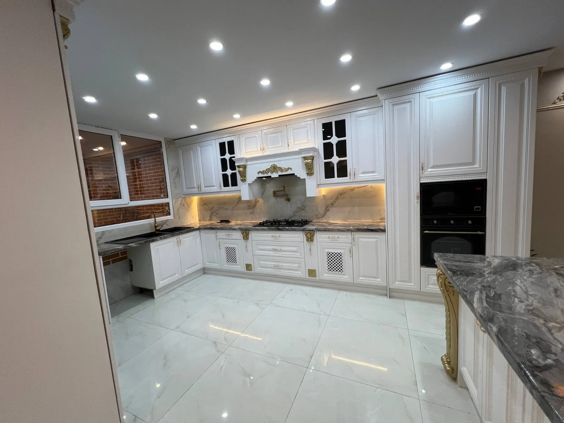 Finished Saadat Abad kitchen full view showing cabinetry and island