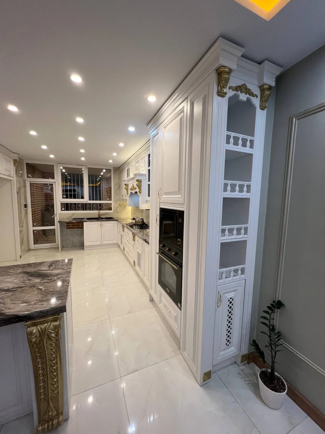 Completed tall cabinet and open decorative shelves in the Saadat Abad installation