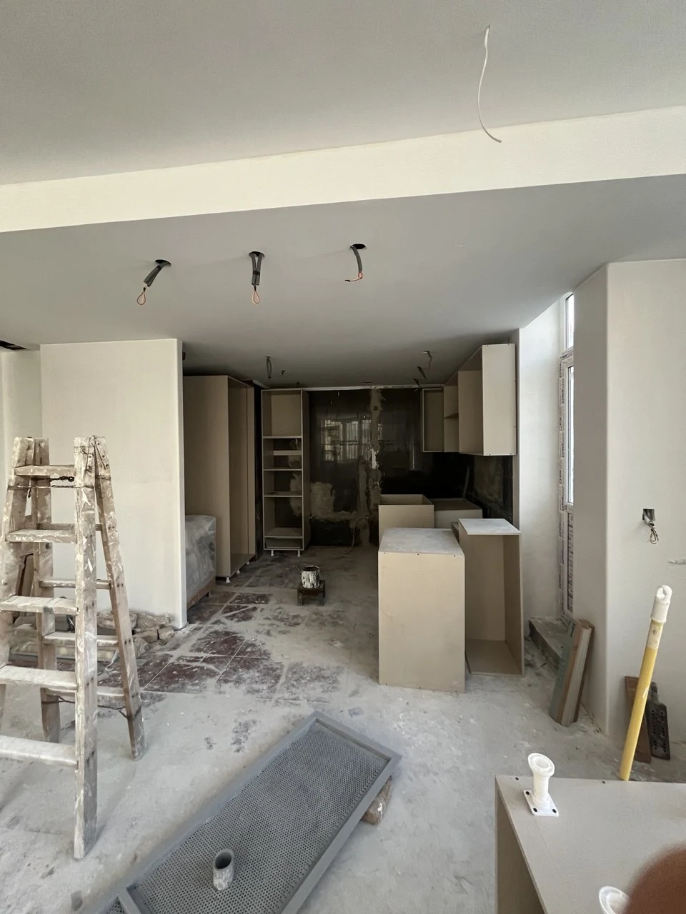 Neoclassical cabinet structures and units being fitted on site
